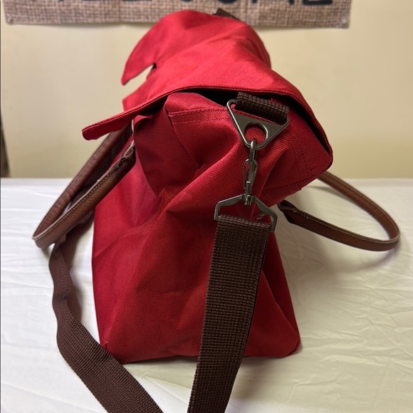 Red and Brown Travel Bag with Adjustable Strap and Sturdy Design - Picture 3 of 10